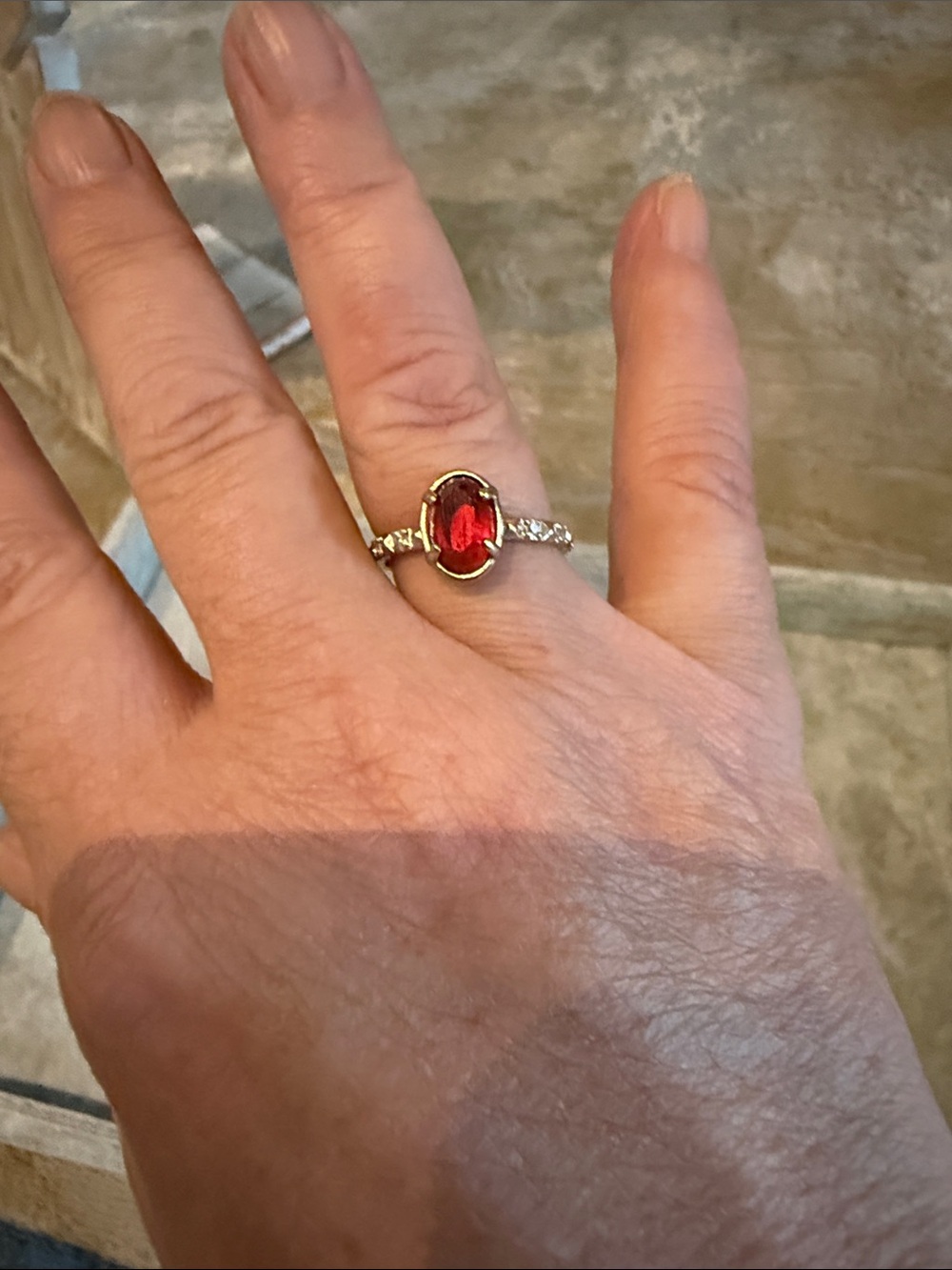 Kendra Scott Gold Ring with Red Oval Stone and Clear Accent Stones